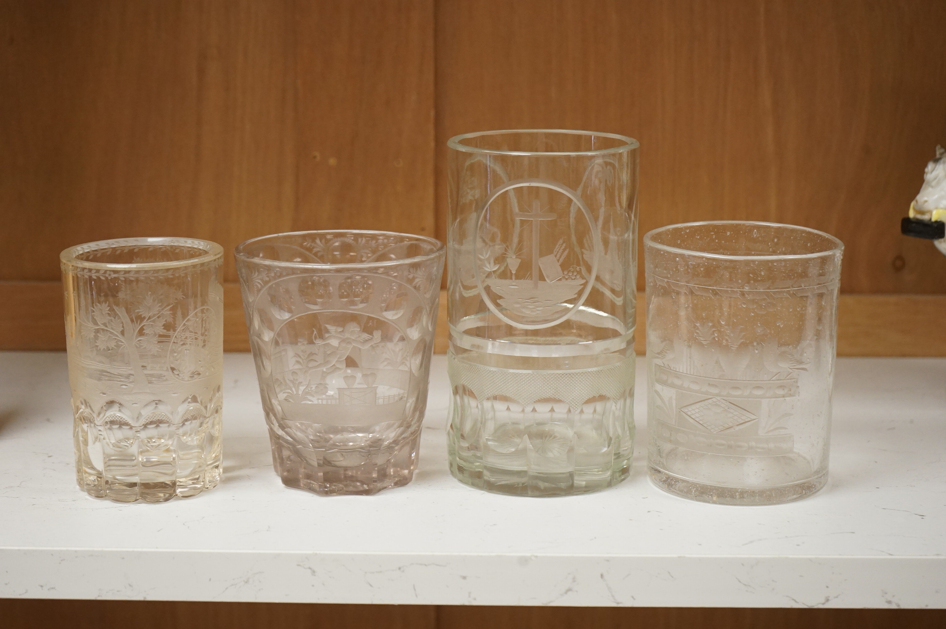 Four German or Bohemian engraved glass beakers, 19th century, largest 16cm high